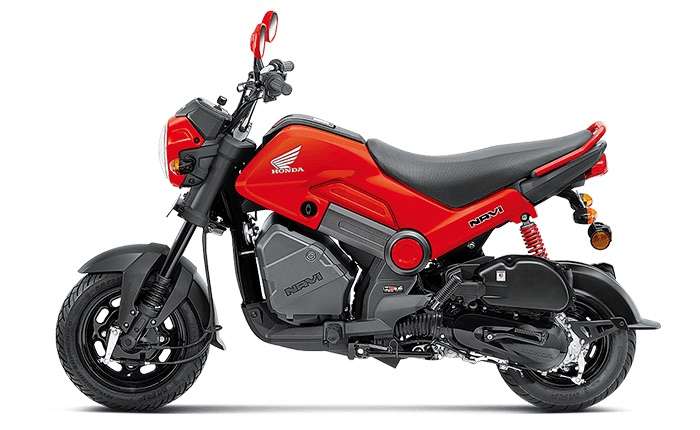 Red Honda Navi scooter on a white background
